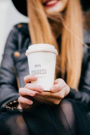 girl with coffee after yoga classes