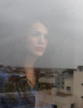 beautiful women looking through the window