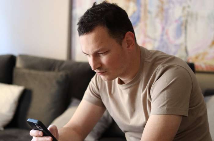 confident man sending texts when things change